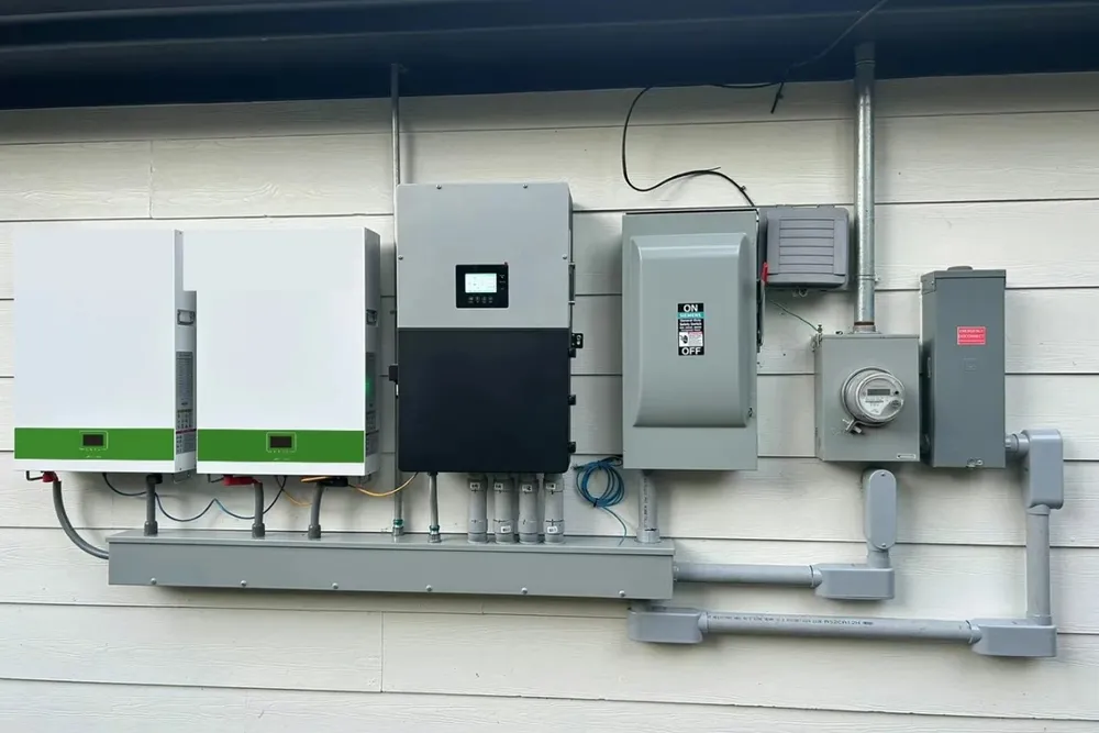 Grid-tied white battery system beside utility equipment