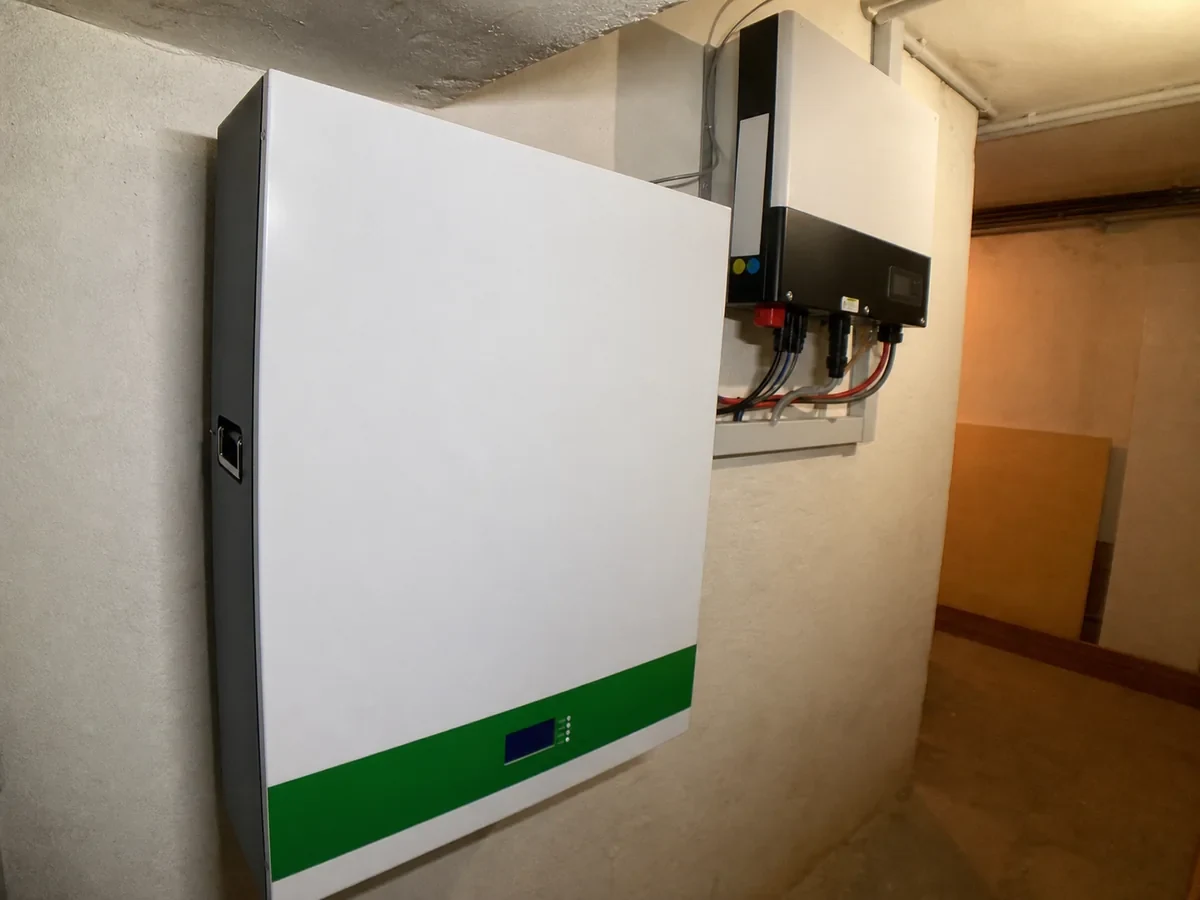 Compact wall-mounted LFP battery and inverter installation in a small indoor equipment space