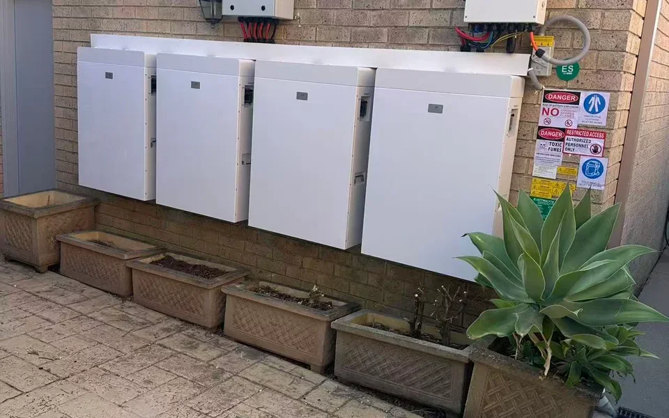 Outdoor residential wall battery row in Australia
