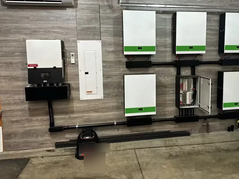 Indoor utility room battery and hybrid inverter installation beside a residential panel