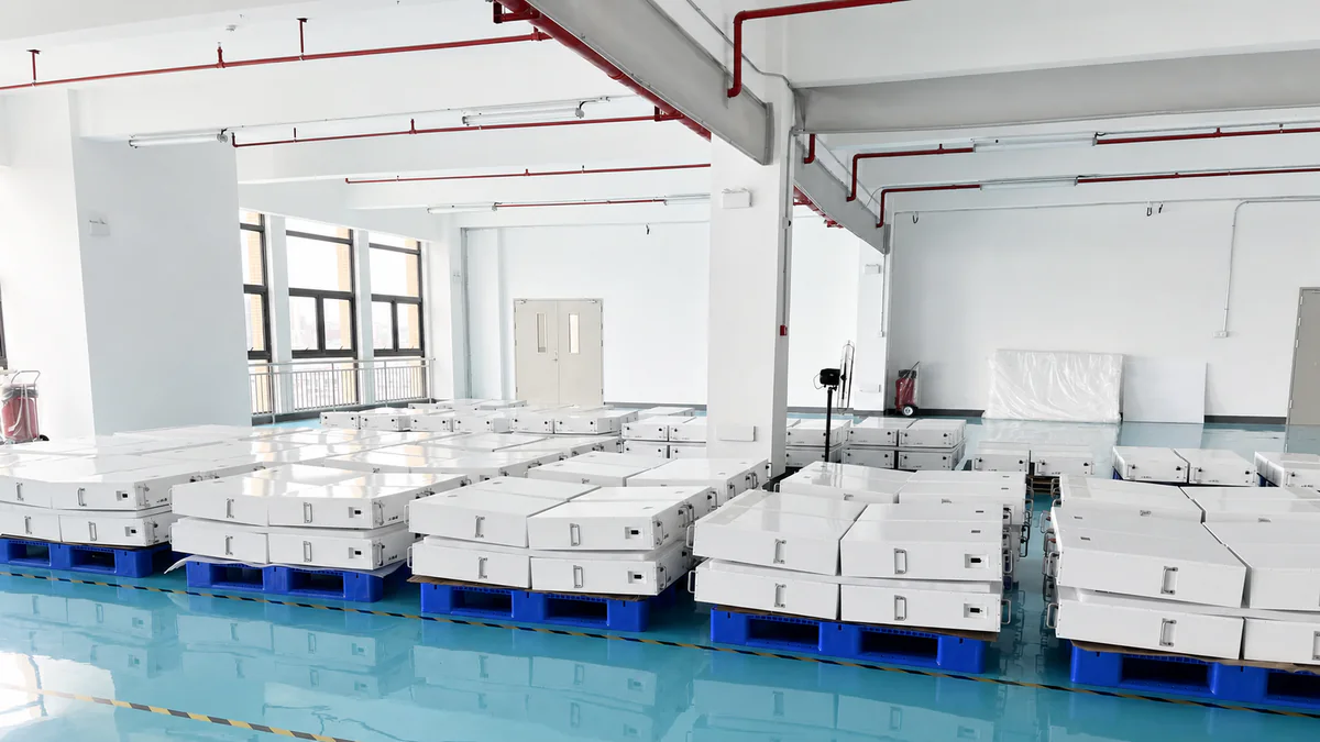Finished battery packs staged in a production facility